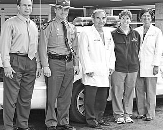 <p>Special to The Vindicator</p>
<p>SAFETY MISSION: Participating in the “Leave No Senior Behind” program are, from left, Edward Hofsess, CEO of New Life Hearing Aid Center; Lt. Chris Heverly of the Ohio State Highway Patrol; and Dr. Robert Gerberry, Mary Sierra, and Dr. Sergul Erzurum, all of Eye Care Associates. The program was initiated to raise awareness of the importance of vision and hearing testing for senior citizen drivers.</p>