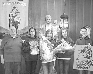 <p>Special to The Vindicator</p>
<p>GIFT BASKETS: This year St. Joseph Home and School annual basket raffle is doubling as a food drive for the St. Vincent de Paul Society’s Food Pantry. Items to be raffled at the event are displayed by, from left, Tom Williams, president of the St. Vincent de Paul Society of St. Joseph’s; Carlie Chepke; Nicole Zielinski; Lindsay Ignazio and Vinnie Boerio, student council officers of the St. Joseph School.</p>
