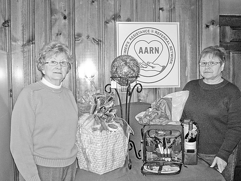 <p>Special to The Vindicator</p>
<p>GIFT WRAPPED: A few of the Items that have been donated for a charity auction to be sponsored by the Alzheimer’s Assistance and Referral Network are displayed by, from left, JoAnn Reese and Patricia Corsale.</p>