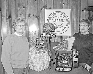 <p>Special to The Vindicator</p>
<p>GIFT WRAPPED: A few of the Items that have been donated for a charity auction to be sponsored by the Alzheimer’s Assistance and Referral Network are displayed by, from left, JoAnn Reese and Patricia Corsale.</p>
