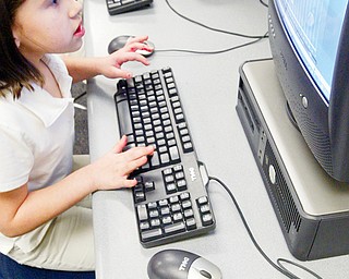 Lowellville 3rd grader Jessica Grow competes in world Math Day event at her school Wed. 