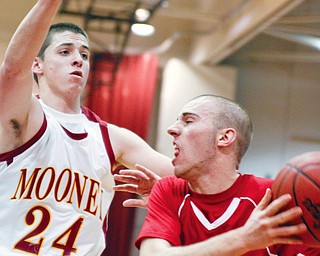 Mooney Eddie Reese (24) blocks Salem Jordon Strabala (11) at Boardman High School, Wednesday March 4, 2009