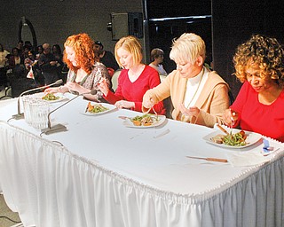 TASTE TEST: Four lucky women were selected to dine with McCargo after he prepared pepper-crusted steak with two side dishes. They are, from left, Vanessa Houk, 31, of Girard; Lisa Catauro, 28, of Watervliet, Mich., originally from New Springfield; Martha Mancino, 50, of Youngstown; and Linda Bell, 57, of Liberty.