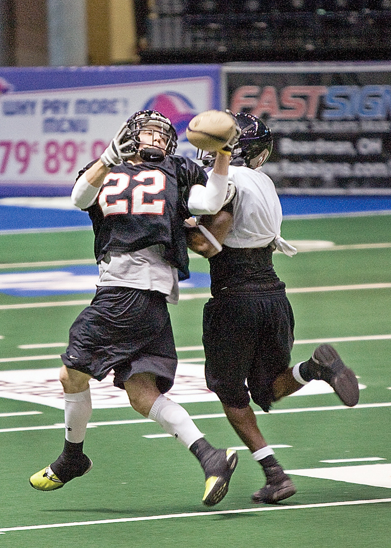 Chris Schubert (22) makes a catch against Clarence Curry during The Mahoning Valley Thunder practice at the Chevey Centre on Tuesday March 25, 2009.