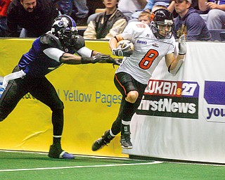 Thunders #7 Clarence Curry - pushes #8 Anthony Rodriquez against the wall during third quarter action at at the Chevy Centre Thunder opener.
