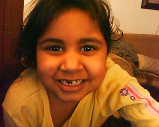 ALICIA CORTEZ of Youngstown, who is in kindergarden at Byzantine Catholic Central School, smiles after losing another tooth.