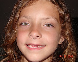 KELSEY GARTLAND from Austintown sports a toothless grin.