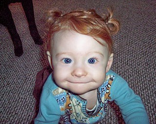 This is KIRA MCAFOOSE, who will be 1 on Tuesday. She is still awaiting her first tooth! She is the daughter of Kimberly and Gary McAfoose of McDonald.