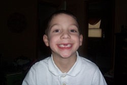 Six-year-old NATHAN LESKOVAC, son of Tom and Amy Leskovac, Austintown, shows off his toothless smile.