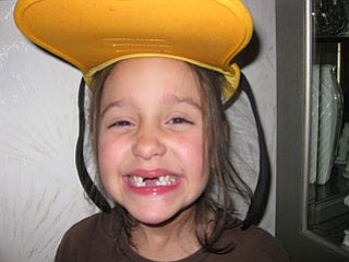 SKYLER HUDA, a first-grader at Dobbins Elementary School in Poland, stopped at Nana and Papa DeLuca’s home in Struthers to show off her “Goofy” hat and missing teeth. She had just gotten back from a Disney cruise with her parents and brother.