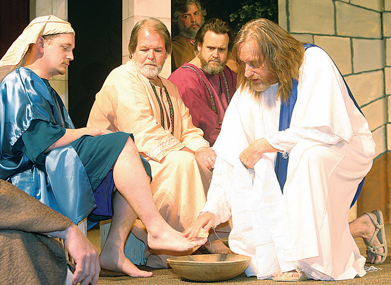 Jesus played by Dennis Carpenter washes the feet of his apostles Saturday afternoon in Niles. 