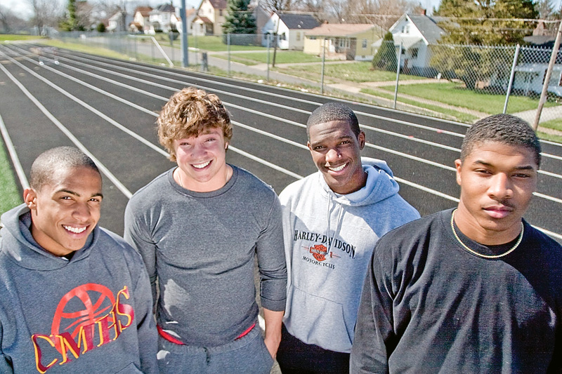Sprinters on the Cardinal Mooney Track Team, Charlie Brown (sophmore), Scott Johnson (senior), Matt McWilson (senior), Braylon Heard (junior) pose for a portrait at Cardinal Mooney Track on Wednesday April 8, 2009.