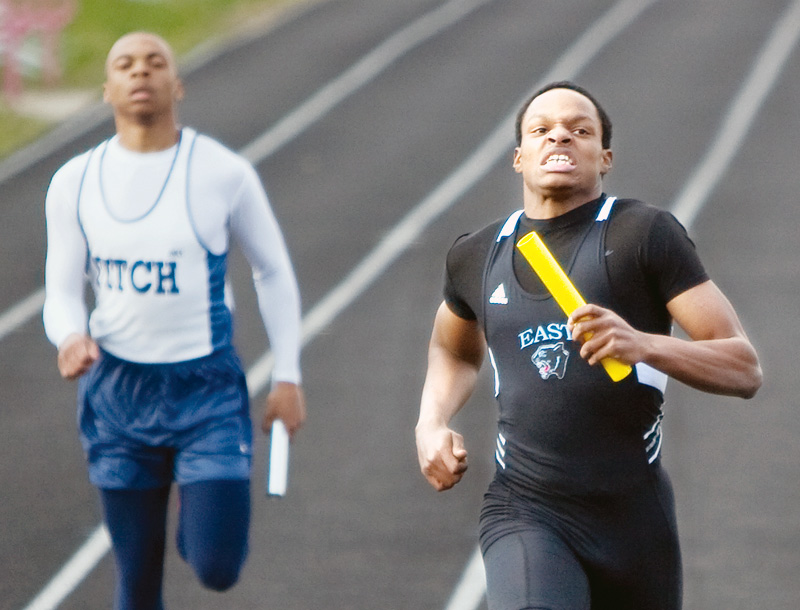 East High School's Alex Pettway mantains his determination as he crosses the finish line finishing first in the 4 x 200m relay during the Cope Invitational at Reilly Stadium in Salem on Thursday evening. 
