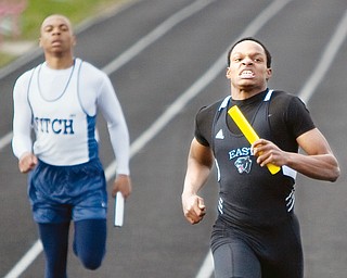 East High School's Alex Pettway mantains his determination as he crosses the finish line finishing first in the 4 x 200m relay during the Cope Invitational at Reilly Stadium in Salem on Thursday evening.