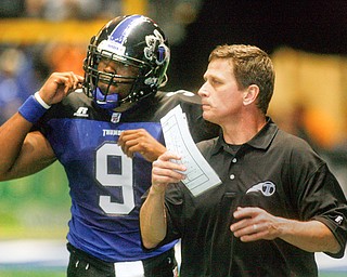 GOOD WORDS - Mike Hold talks with QB Davon Vinson during second quarter action - at the Chevy Centre Thunder opener.