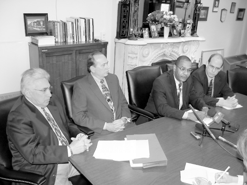  From left, Atty. Danny Thomas of Warren, Law Director Greg Hicks, Safety Service Director Doug Franklin and Mayor Michael O'Brien discuss the agreement with the city John Mandopoulos signed with the city on Wednesday. Mandopoulos, chief since December 2000, agreed to step down immediately and remain on sick leave until Aug. 10, when his retirement begins. Mandopoulos is 61 years old.
