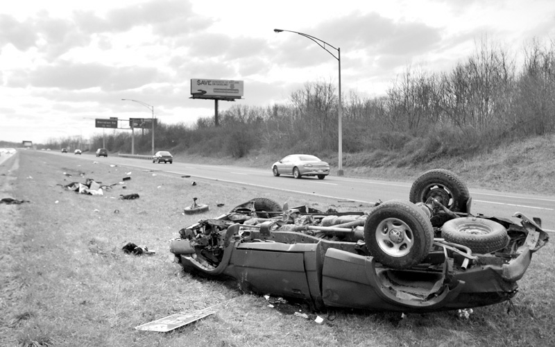A red ford pick up truck lays overturned in the median of 680 after leaving the roadway of 680 south. Youngstown  Police responded to the accident where the vehicles only occupant was a male who was ejected from the vehicle and taken away from the scene by an ambulance most likely headed to St. Elizabeth's.