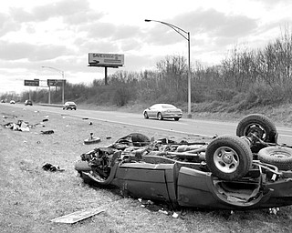 A red ford pick up truck lays overturned in the median of 680 after leaving the roadway of 680 south. Youngstown Police responded to the accident where the vehicles only occupant was a male who was ejected from the vehicle and taken away from the scene by an ambulance most likely headed to St. Elizabeth's.