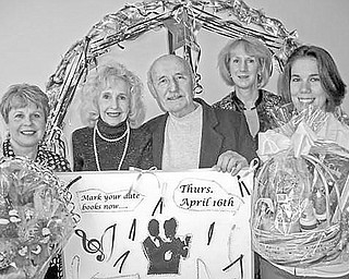 <p>Special to The Vindicator</p>
<p>PUTTIN’ ON THE RITZ: Items to be awarded during a Chinese auction at the third annual senior prom night at Girard Multi-Generational Center are displayed by, from left, Paulette Kern, administrative assistant at the center; Doloris Krok and Eddie Krok, guests at the center; Laura Carey-D’Rummo, administrative director; and Jennifer Miller, assistant program director.</p>