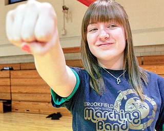 Abby Burton, 16, of Brookfield punches during a self defense course for females ages 16-18 at the Jewish Community Center.