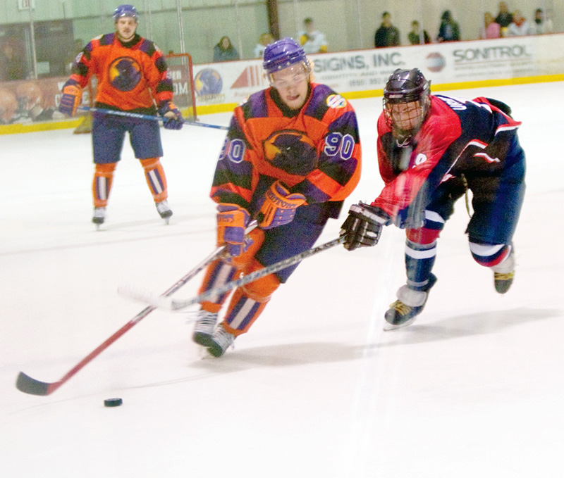 Mahoning Valley Phantom Stefan Salituro (90)takes the puck down the ice past Traverse City North Stars Nate Urbaniak (9) during the second period at The Ice Zone Sunday evening.