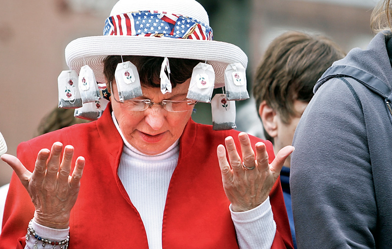 Pat Eccleston of Lisbon prays in Lisbon Square for Lisbon's Tax Day Tea Party to protest Washington's "socialist" direction.