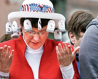 Pat Eccleston of Lisbon prays in Lisbon Square for Lisbon's Tax Day Tea Party to protest Washington's "socialist" direction.