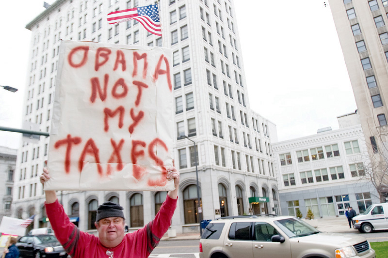 Richard Ellis, of Youngstown, participates in a Tea Party, standing for Taxed Enough Already, on Federal Plaza in downtown Youngstown on Wednesday afternoon. 
