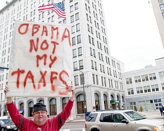 Richard Ellis, of Youngstown, participates in a Tea Party, standing for Taxed Enough Already, on Federal Plaza in downtown Youngstown on Wednesday afternoon.