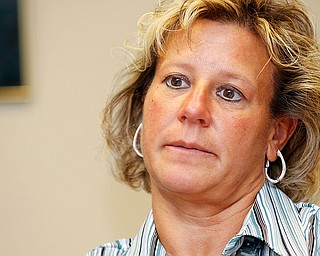 Susan Skrzynski of Boardman discusses her military career and the convention in a board room at Oak Hill Renaissance building along with two other women veterans.