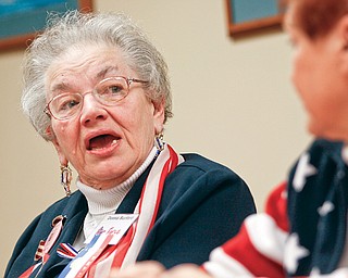 Donna Burford discusses her military career and the convention in a board room at Oak Hill Renaissance building along with two other women veterans.