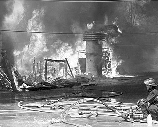 No water:  The fire hoses have little water left to fight the blaze. Apr. 26, 1984