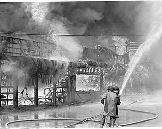 Video arcade, Ski ball and concessions stands burn on the south west side of of the midway. Apr. 26, 1984.