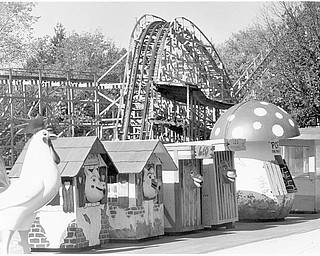 Anyone whoever went to the park will remember the famous trash cans, now lined up for the auction. The remains of the Wild Cat can be seen in the background. Oct. 18, 1984