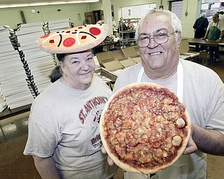 Steve and Marian DeGenaro in the kitchen at St Anthony Church in Youngstown Friday 4-24-09. They and about 25 volunteers make and sell several hundred pizza's/week as a church fundraiser.