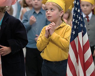 NICHOLAS LAPLANTE wears his favorite cap, graduating from preschool at
the Holy Family School in Poland.