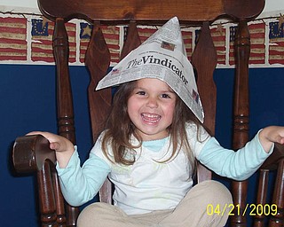 Do you remember the paper hats made from The Vindicator? Here is 3-year-old GIANNA PICCUTA of North Lima wearing one made by her 85-year-old great-grandma, Millie Boda.
