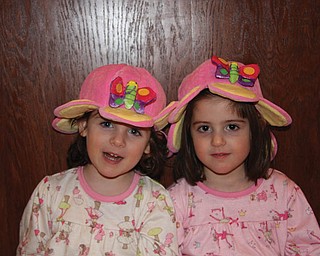 LILY AND CARLINA VARI-COPPOLA, age 4, of Lowellville are wearing their butterfly hats they got at the Buffalo Zoo.
