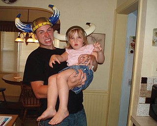 ERICK HOOVER and his niece, Madalyn Smith, are clowning around as vikings.

