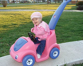 One-year-old MARY GIOVANNA of Boardman loves putting on her pink hat and going for a ride in her pink car.