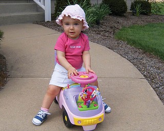 KATIE LYNN DANCE, 1, is ready to go for a springtime ride in her little car. She is the daughter of Bob and Terri Dance of Green Township.
