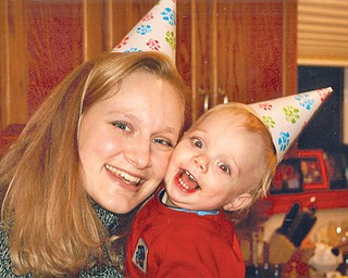 SARAH BETH AND TRISTAN JEFFREY CORNEY of Stacy, Minn., donned birthday hats to celebrate Tristan’s first birthday. They are the daughter and grandson of Karen and Phil Buchmann of Salem.
