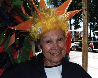 ROSEMARIE ECKENRODE of Boardman could’t resist trying on some of the crazy hats in the shops at Put in Bay.