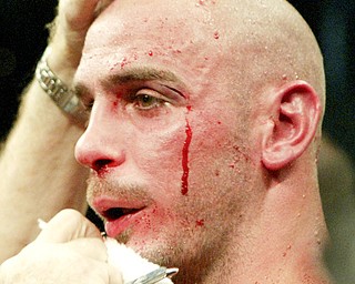 Middleweight World Champion Kelly Pavlik is tended to by a trainer after being beaten by Bernard Hopkins in a non title bout in Atlantic City NJ 10/18/08. William D. Lewis/The Vindicator