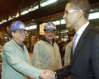 Barack Obama shakes hands with RTI employee Bernie Desmond of Girard during a visit 02/12/08 to the Niles plant. In background is Len Bergana. William D. Lewis/ The Vindicator