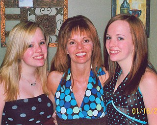 Tammy Valley, middle, with her twin daughters. Karlina, left, and Natalina turn 16 today! They are of Canfield.