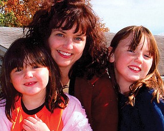 Katrina Wolfe with daughters, KayLee and Kacey, of Columbiana.