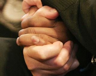 Deborah Chattman, an aunt of murder victim Helen Moore holds hands with a victims rights advocate during the reading of a guilty verdict for Curtis Young in Mahoning County Common Pleas Court Friday May 8 , 2009 in Youngstown.