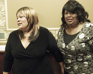 Arvella Smith, left, a cousin of murder victim Helen Moore and Deborah Chattman, aunt of murder victim, both of Warren, react outside Mahoning County Courtroom after Curtis Young was found guilty on all counts Friday May 8, 2009.