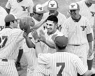 YSU BASEBALL - Joe Iacobucci is all smiles after hitting a home run Saturday afternoon in Niles.